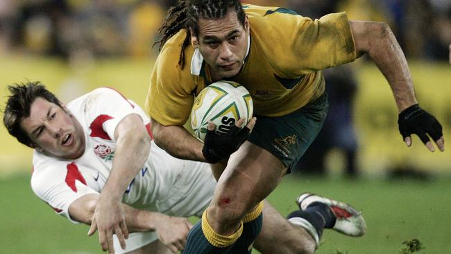 Wallabies player George Smith gets past Tom Voyce.