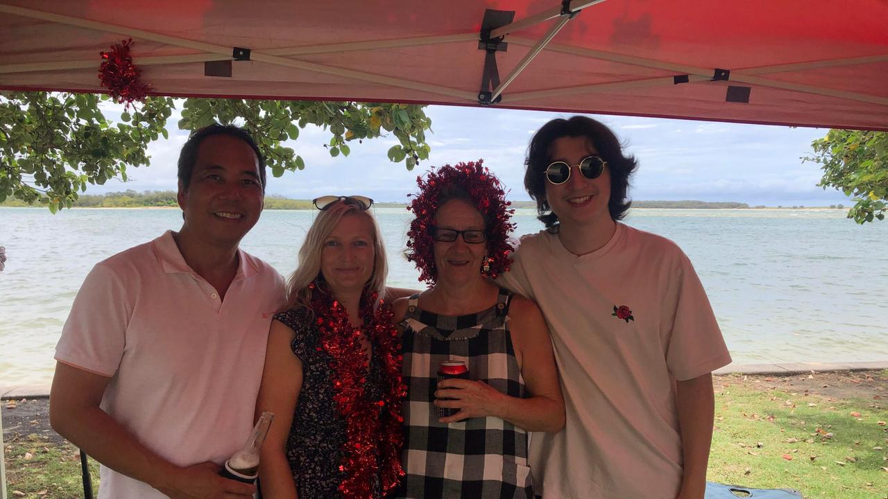 Ken, Jo and Harry Chan enjoy Christmas celebrations with Robyn Johnston (second right) at Cotton Tree Park. Picture: Laura Pettigrew.