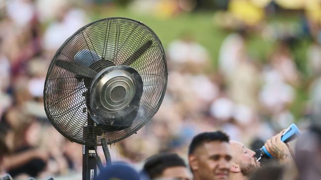 A fan blows mist onto the Eels bench during the NRL Trial Match between the Penrith Panthers and the Parramatta Eels at BlueBet Stadium. Picture: Brett Hemmings/Getty Images