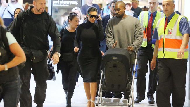 Kim Kardashian and husband Kanye West arrive into Melbourne airport to much fanfare.