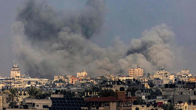 Smoke billows over Khan Yunis during Israeli bombardment from Rafah in the southern Gaza Strip on December 25. Picture: AFP