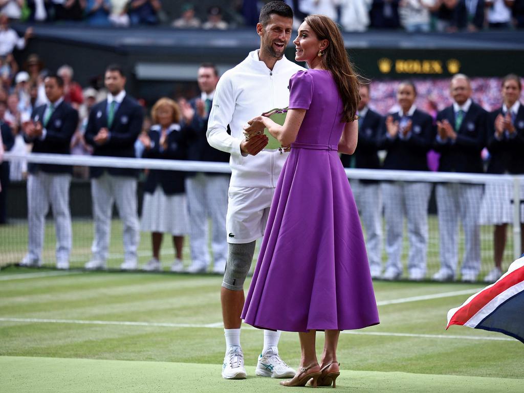 Second-placed Serbia's Novak Djokovic (L) receives his price from Catherine, Princess of Wales (R) following his defeat against Spain's Carlos Alcaraz during their men's singles final. Picture: AFP