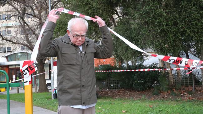 Resident Desmond Silverwood comes out from a tight lockdown at the North Melbourne towers. Picture: David Crosling