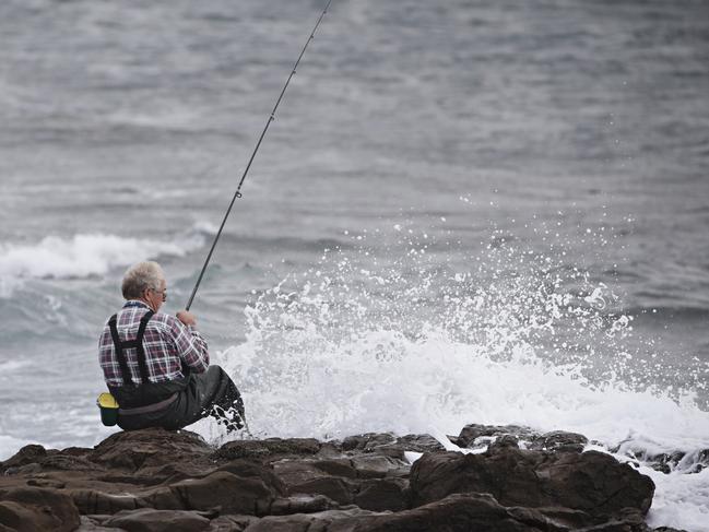 Gary Cuzner who has been fishing at Hill 60 Near Fishermans Beach for over 50 years on an area he considers to be safe around the corner to where two men were swept off rocks at Hill 60 near Fishermans Beach in Port Kembla on the 13th of February. Picture: Adam Yip