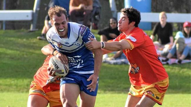 HELD UP: Ghosts centre Dylan Collett is halted by the Coffs Harbour Comets defence in the defeat last weekend. Picture: Amy Hodge