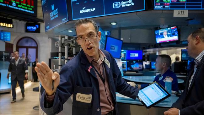 Traders work the floor of the New York Stock Exchange on August 16, 2024. US stocks edged lower in early trading Friday, as traders looked to lock in gains at the end of a positive week for major Wall Street indices. Around 10 minutes into trading, the Dow Jones Industrial Average was down 0.1 percent at 40,518.87, and the S&P was 0.1 percent lower at 5,536.08. The Nasdaq slipped 0.2 percent to 17,566.08. (Photo by ANGELA WEISS / AFP)