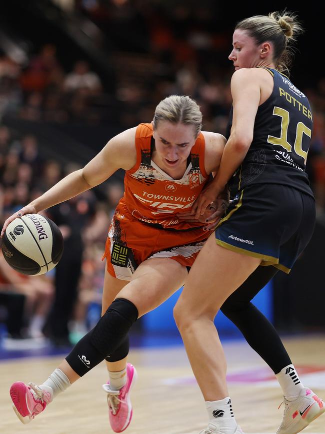 Townsville’s Courtney Woods is guarded by Canberra’s Gemma Potter in December, 2023. Picture: Mark Metcalfe/Getty Images.