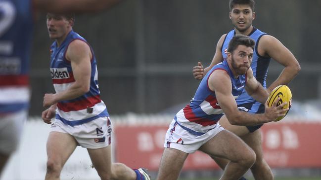 SANFL: Sturt v Central District at Unley Oval. Central's Isaya McKenzie breaks away with the ball. 2 June 2019. (AAP Image/Dean Martin)