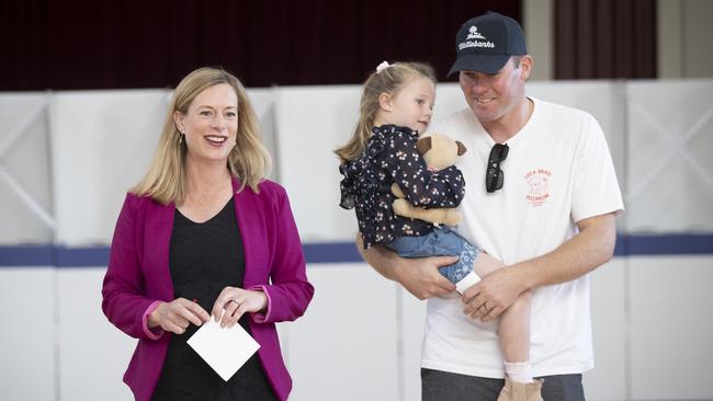 Labor Leader Rebecca White, with partner Rodney Dann and daughter Mia, 4, vote at the Sorell Memorial Hall. Picture: Chris Kidd