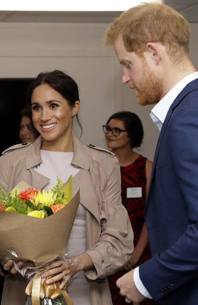 The couple had changed out of their “welly-wanging” gear. Credit: AP Photo/Kirsty Wigglesworth, Pool