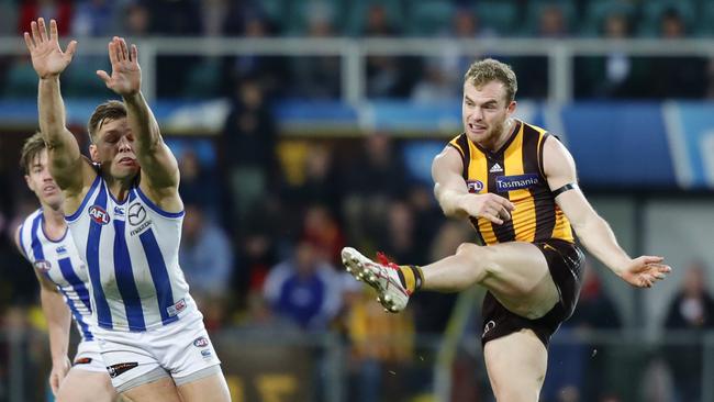 Tom Mitchell with one of his 35 disposals against North Melbourne.