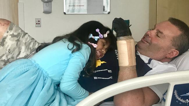 Jason 'Buddy' Miller at Northern Beaches Hospital with his daughter Jhayda, then 7. Picture: Supplied.