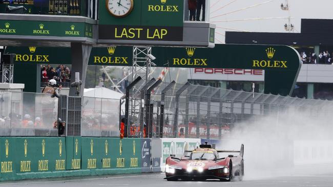 The Ferrari AF Corse, Ferrari 499P of Antonio Fuoco, Miguel Molina, and Nicklas Nielsen takes the flag at the finishing line to win the 24 Hours of Le Mans. Photo by Ker Robertson/Getty Images