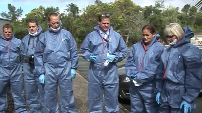 Donna McAvoy (second from right), convicted for the murder of police officer Damian Leeding, participates in a walk-through with police and her lawyer of the Pacific Pines Tavern.