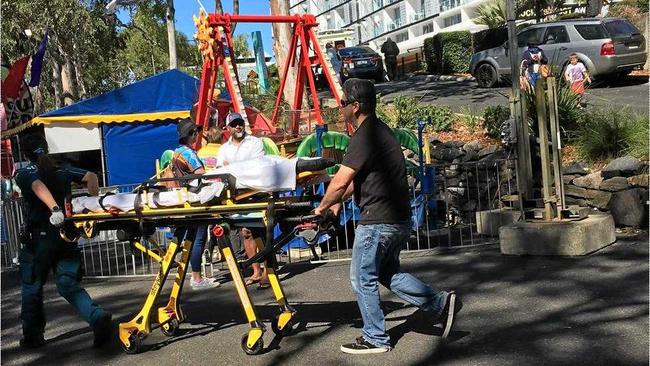QAS staff had to manoeuvre around the Riverfest to stretcher Taylor-Leigh to hospital. Picture: contributed