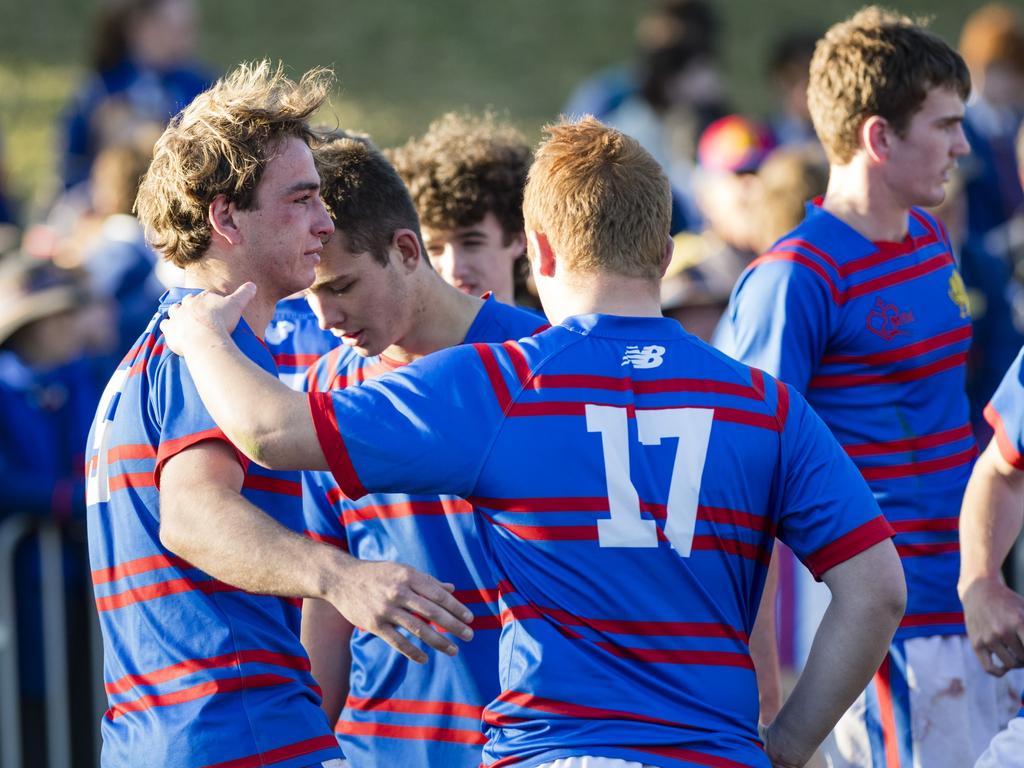 Downlands players console each other after going down to Grammar.