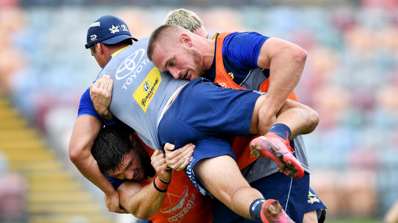 Scott Drinkwater is tackled at Cowboys training.