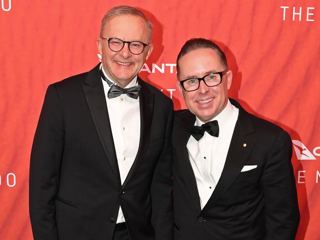 SYDNEY, AUSTRALIA - MARCH 31: Australian Prime Minister Anthony Albanese (L) stands with Qantas CEO Alan Joyce as they attend the Qantas 100th Gala Dinner at Jetbase 96 hangar at Sydney's International Airport on March 31, 2023 in Sydney, Australia. (Photo by James D. Morgan/Getty Images)