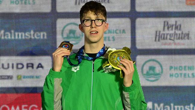 Gold medallist Daniel Wiffen of Ireland celebrates during the podium ceremony for the men's 800m Freestyle of the European Short Course Swimming Championships in Otopeni on December 10, 2023. (Photo by Daniel MIHAILESCU / AFP)