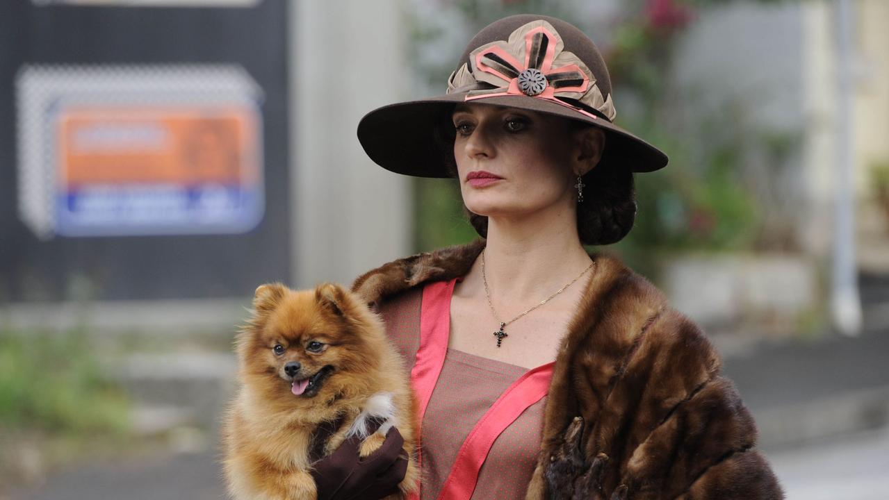 Actor Danielle Cormack, as underworld boss Kate Leigh, holds the pomeranian that starred in Underbelly: Razor before it died and was whisked to Markus Michalowitz’s workshop.