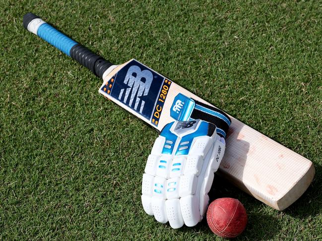 SYDNEY, AUSTRALIA - NOVEMBER 28: Gloves, balls and bats are seen laid out on the field prior to the NSW Premier Cricket Poidevin Gray Shield match between Parramatta and Bankstown at Bankstown Oval, on November 28, 2021, in Sydney, Australia. (Photo by Jeremy Ng/News Corp Australia)