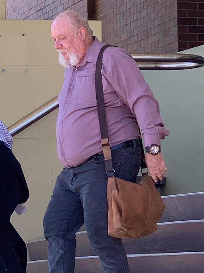 Brian Peter Rogers (right) leaves court after pleading guilty to possessing child exploitation material. Photo: Elyse Wurm