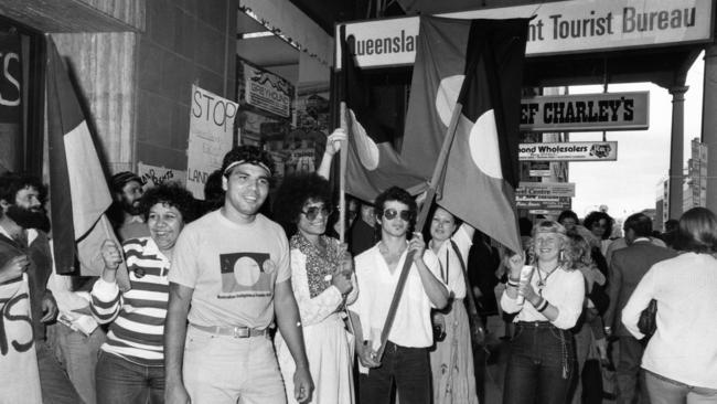 Warren Mundine, chairman of the Justice Before Games support group, leads a group of demonstrators in front of the Queensland Tourist Bureau in Adelaide in 1982.