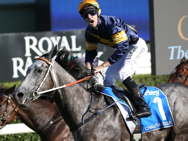 Jockey Tommy Berry on Chautauqua stands up in his saddle as they win the Darley TJ Smith Stakes race during The Championships Day 1 at Randwick Racecourse in Sydney, Saturday, April 1, 2017. (AAP Image/David Moir) NO ARCHIVING, EDITORIAL USE ONLY