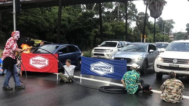 Fireproof Australia and Floodproof Australia protesters block traffic in Sylvania on Saturday morning. Picture: Facebook