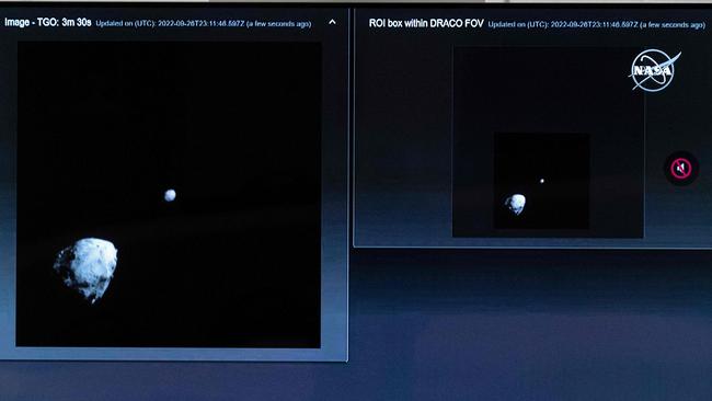 A television at NASA's Kennedy Space Center in Cape Canaveral, Florida, captures the final images from the Double Asteroid Redirection Test (DART) as it approaches asteroid Dimorphos (R), past asteroid Didymos (L). Picture: AFP