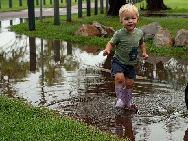 Cobi Murphy enjoys the splash at Nightcliff Park during the monsoonal weather. Picture: Pema Tamang Pakhrin