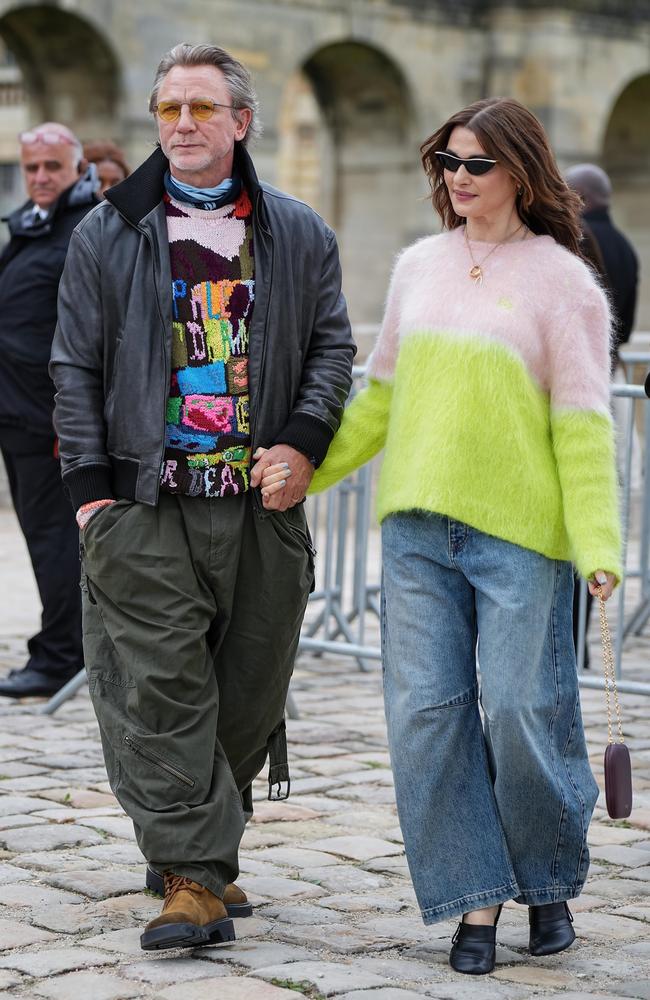 Daniel Craig looks to be distancing himself as far from his old tuxedoed James Bond style, seen here with wife Rachel Wiesz, also at the Loewe show. Picture: Splash/Backgrid