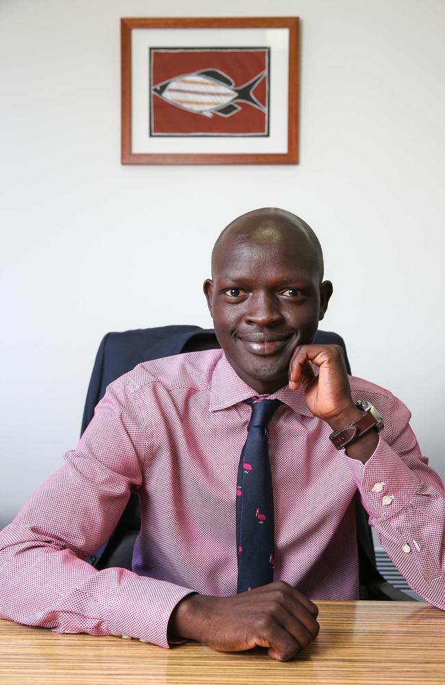 Daniel Ajak in the offices of Papa Hughes Lawyers, where he works. Picture: Ian Currie