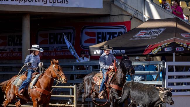 Mount Isa Rodeo 2024 - Bob Holder, 93, and Tate Smith, 9, competing in the team roping at the Mount Isa Rodeo. Picture by Luke Marsden.