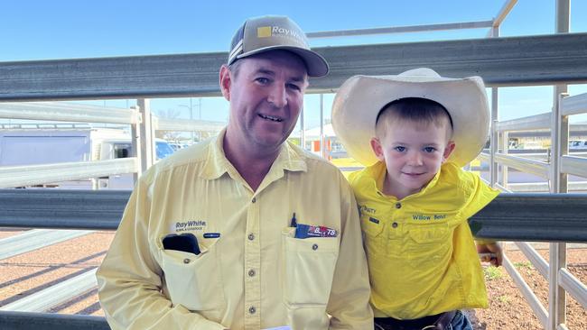 Three-year-old Dusty Rafferty and his father Simon Rafferty from Ray White at Tamworth, NSW, were part of the small buying crowd at the Wodonga store cattle sale.