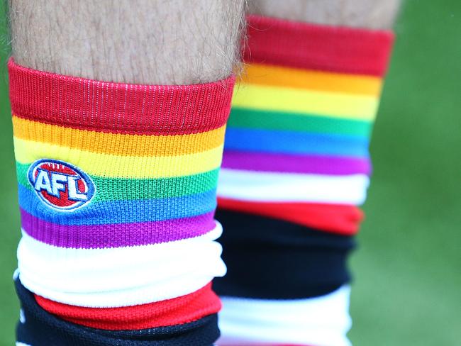 MELBOURNE, AUSTRALIA - JUNE 06:  Hunter Clark (St Kilda FC) shows off his Pride Game socks during a We Are Pride Cup Launch press conference at AFL House on June 6, 2018 in Melbourne, Australia.  (Photo by Michael Dodge/Getty Images)