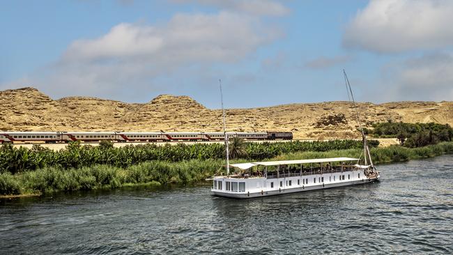 A train travelling beside the Nile River in Egypt. Picture: Getty Images