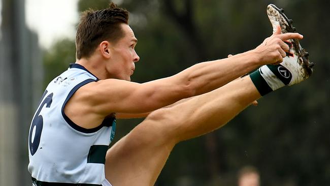 Mickey Nicholls of Old Geelong kicks during the round eight 2023 Premier B Men's match between De La Salle and Old Geelong at Waverley Oval in Malvern East, Victoria on June 3, 2023. (Photo by Josh Chadwick)