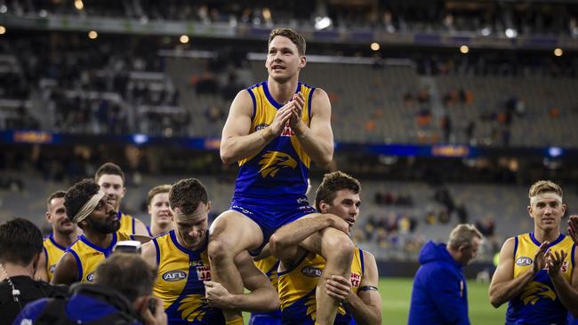 Jack Redden is chaired from the ground after his 200th AFL game. He will play for Willunga in the Great Southern Football League next year. Picture: Tony McDonough