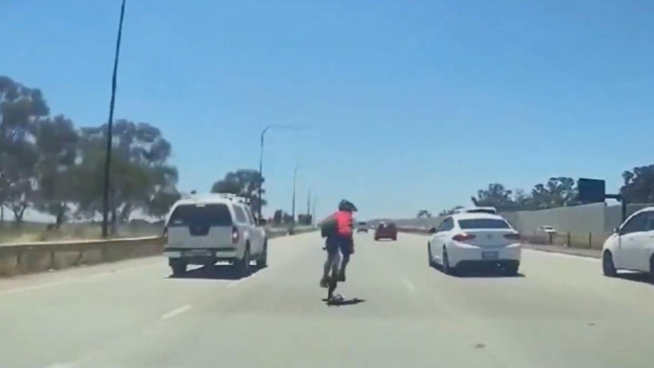 A cyclist has been fined by police after dashcam footage captured him riding in the middle of the North-South Motorway at Bolivar. Picture: 9 News Adelaide