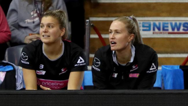 Chelsea Pitman, right, watches from the bench on Saturday. Picture: AAP Image/Kelly Barnes