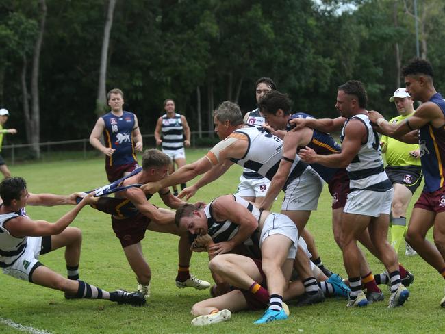 Pictured (l-r): Beau Flint, Patrick Johnson, Nick Salter, Ben Mcphee, Daniel Charlesworth, Dillon Coates and Edward Kadlecek. Fierce contest between Port Douglas Crocs and Cairns City Lions at Holloways Beach. AFL Cairns 2024. Photo: Gyan-Reece Rocha