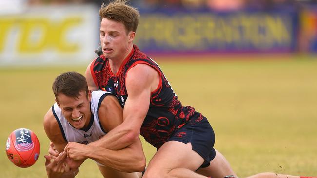 Tom Doedee is tackled by Mitch Hannan. Picture: Getty Images