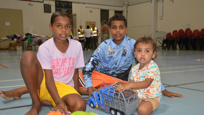 Wujal Wujal residents Latiqua Sykes-Creek, Latrell Sykes-Creek and Kaiyzen Fuller at the Cooktown PCYC evacuation centre. Picture: Bronwyn Farr