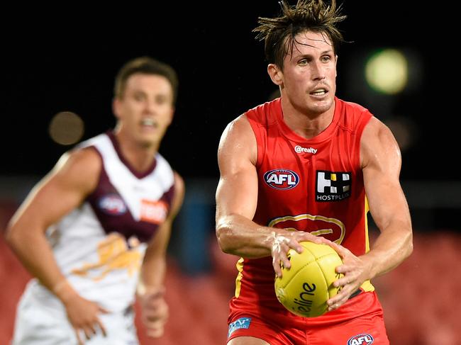 David Swallow looks to move the ball downfield at Metricon Stadium. Picture: Getty Images