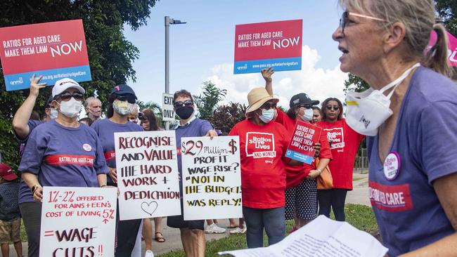 Regis employee Dianne Power addresses the protest outside the Regis Whitfield aged care complex. Picture: Brian Cassey