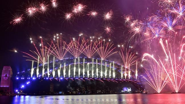 The midnight fireworks light up Sydney Harbour in 2020. Picture: AAP/ Dean Lewins