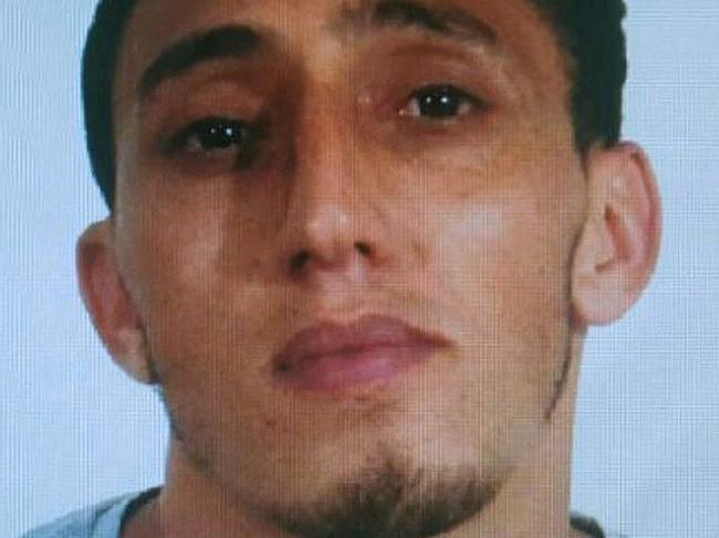 A handout picture provided by the Spanish National Police on August 17, 2017 shows Moroccan Driss Oukabir, alleged suspect linked to the attack of Barcelona on August 17, 2017 when a van ploughed into the crowd, killing 13 persons and injuring over 80 on the Rambla in Barcelona. A driver deliberately rammed a van into a crowd on Barcelona's most popular street on August 17, 2017 killing at least 13 people before fleeing to a nearby bar, police said.  Officers in Spain's second-largest city said the ramming on Las Ramblas was a "terrorist attack". / AFP PHOTO / Spanish National Police / HO / RESTRICTED TO EDITORIAL USE - MANDATORY CREDIT "AFP PHOTO/ SPANISH NATIONAL POLICE" - NO MARKETING - NO ADVERTISING CAMPAIGNS - DISTRIBUTED AS A SERVICE TO CLIENTS