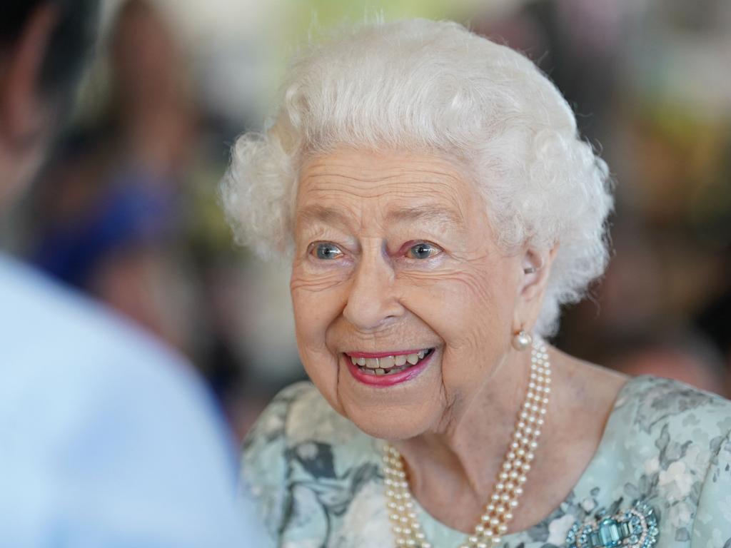 The Queen smiles during her Royal duties, as a national emergency was declared across Britain over an increasing heatwave. Picture: AFP