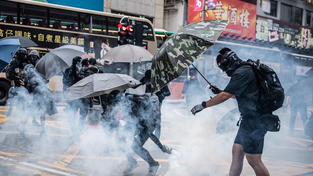 Police fired tear gas and baton-charged the crowds, while some demonstrators threw bricks and petrol bombs at police as night fell.